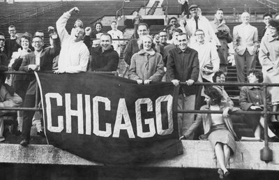 UChicago students cheer during a football game, circa 1950s.