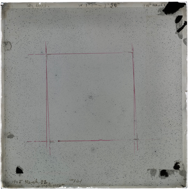 A 12 by 12 inch glass plate negative. The background is gray, with the sky being a slightly darker gray. Handwritten at the top is "Sky da?? W 7h 0m-7h50m 1905 March 2..." Handwritten in the bottom left corner is "1905 March 22 7h 0m-7h50m #161". There are large black areas in the top right and bottom 2 corners. There is a red square drawn in the central 6 inches or so of the plate. The gray sky background is full of black stars.