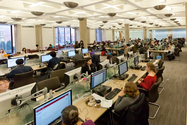 Students working at desktop computers on Regenstein's First Floor