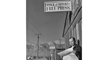 Editor Roy Takeno stands outside the newspaper office at the Manzanar Relocation Center in California, c. 1943. from March Resource of the Month - Japanese-American Relocation Camp Newspapers: Perspectives on Day-to-Day Life