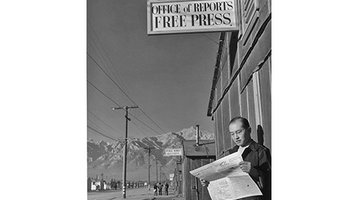 Editor Roy Takeno stands outside the newspaper office at the Manzanar Relocation Center in California, c. 1943. from March Resource of the Month - Japanese-American Relocation Camp Newspapers: Perspectives on Day-to-Day Life