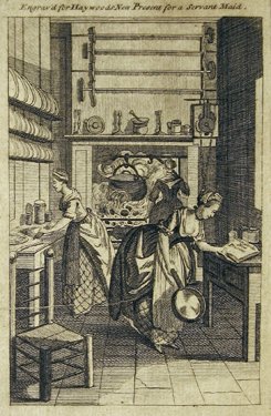 Several women working in a large kitchen.