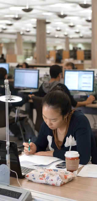 student studying in Regenstein's 1st floor reading room