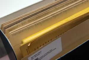 Folders and papers in an archival box