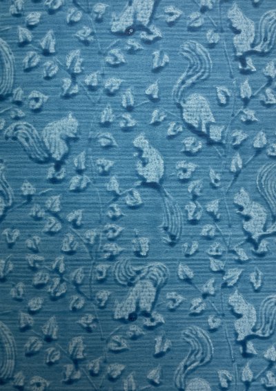 Blue paste paper with decoration of squirrels and acorns