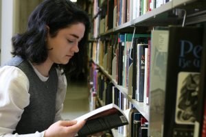 Student browsing the bookstacks