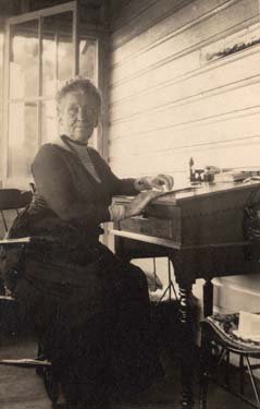 A woman sitting at a desk.