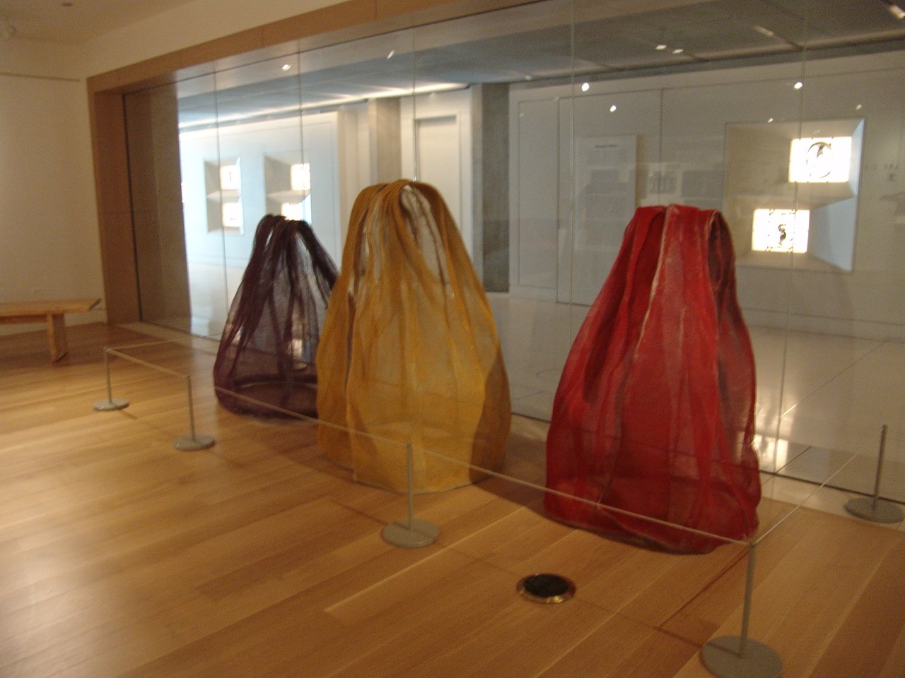 Three poncho sculptures on exhibition.
