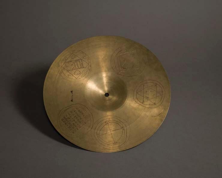 A shiny gold cymbal.