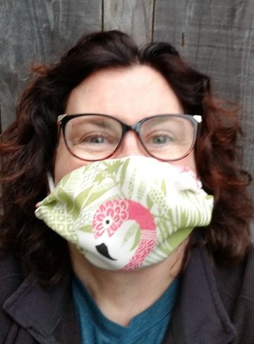 Photo of Ellen Elizabeth Pearson wearing mask with flamingo design