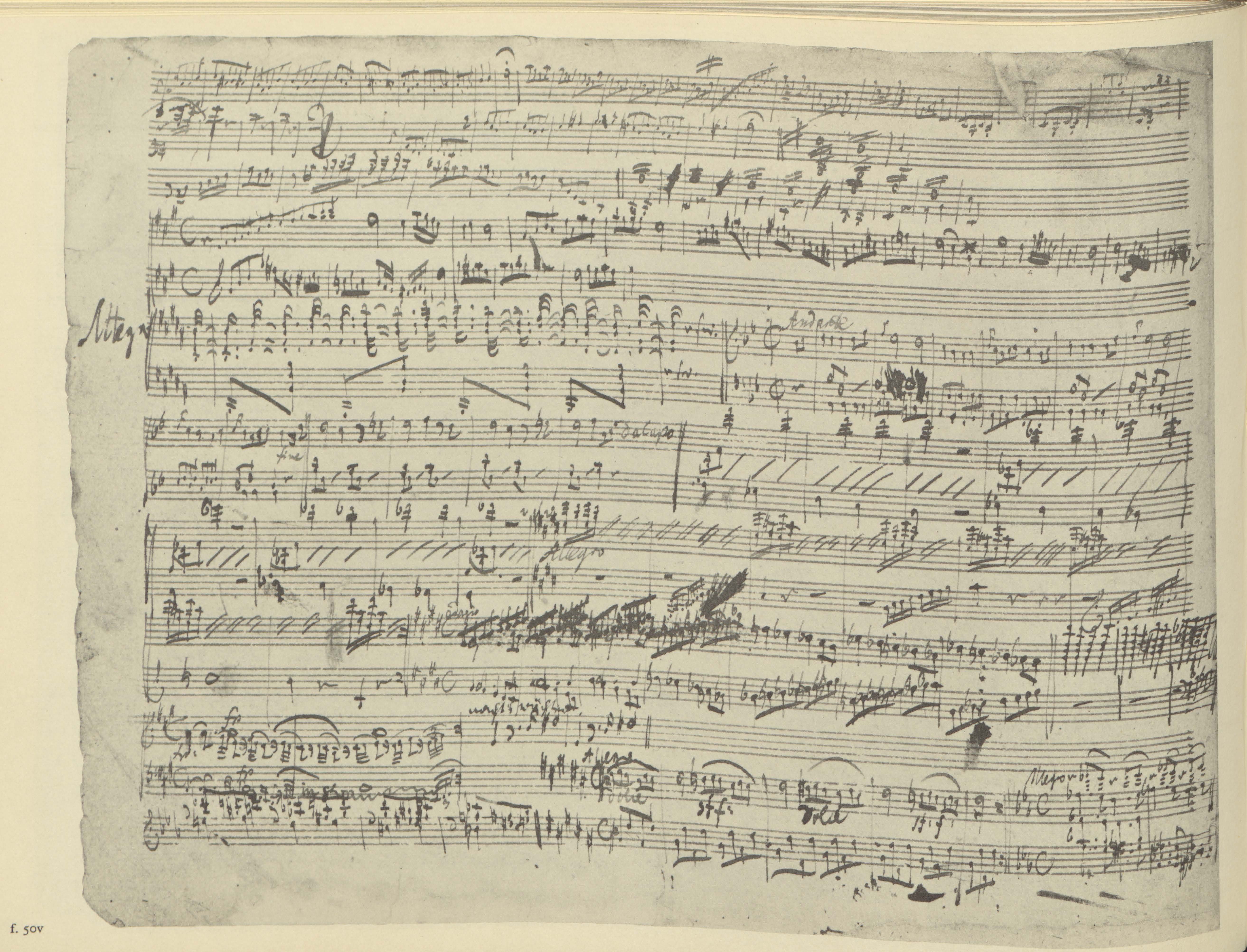 A page of dense handwritten sheet music