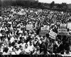 A large group of people with signs protesting