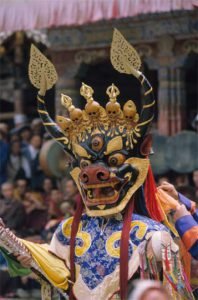 Masked dancer portraying Yama, the Buddhist god of death
