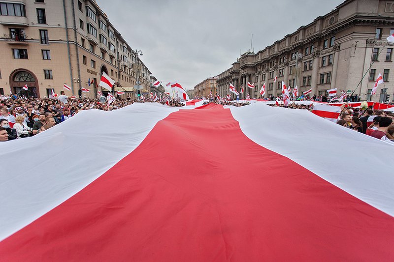 Protest with red and white flag