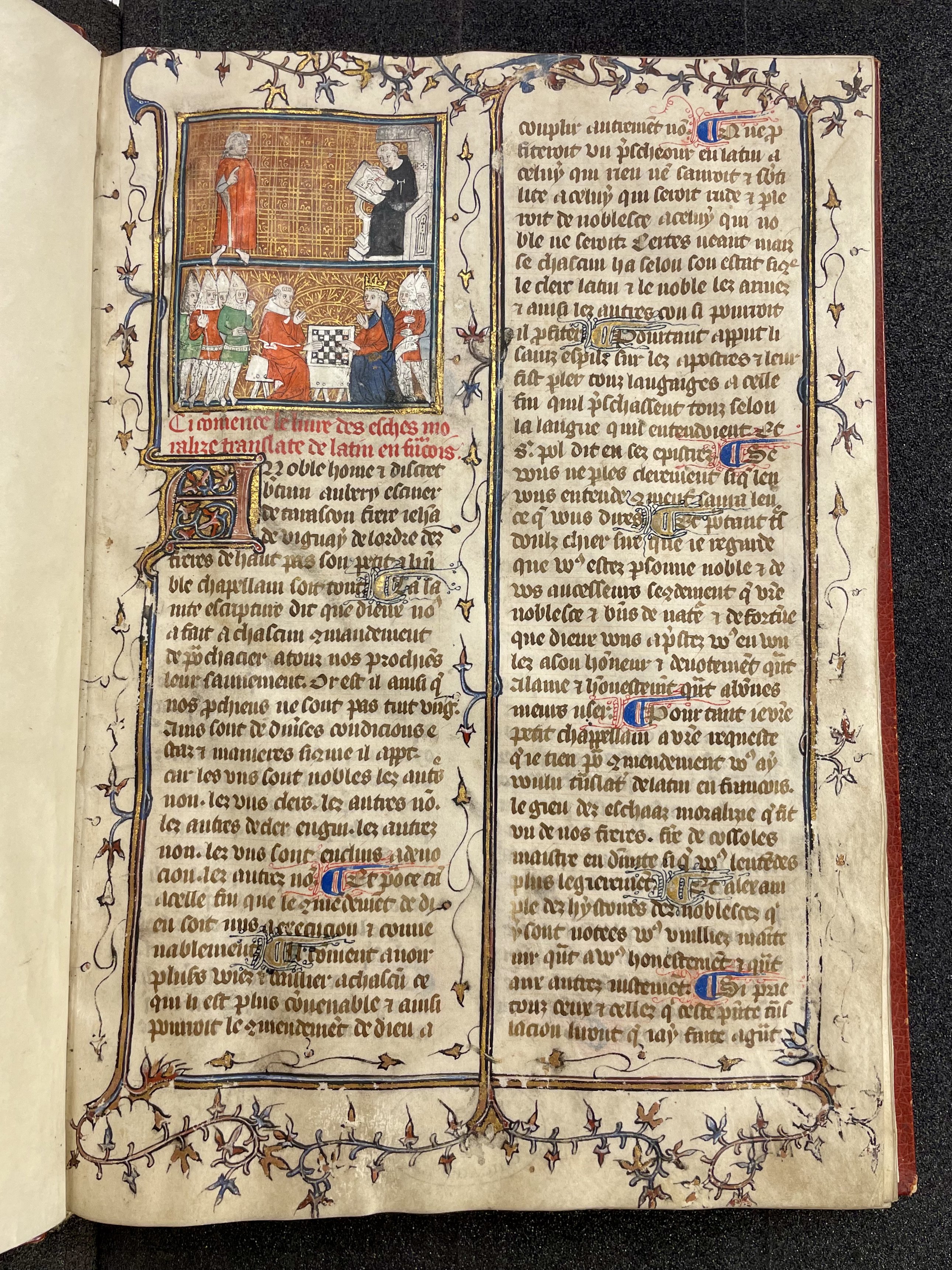 An illuminated manuscript with a small image of people playing chess.