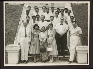 A large group of people standing on a staircase, including Harry G. Johnson