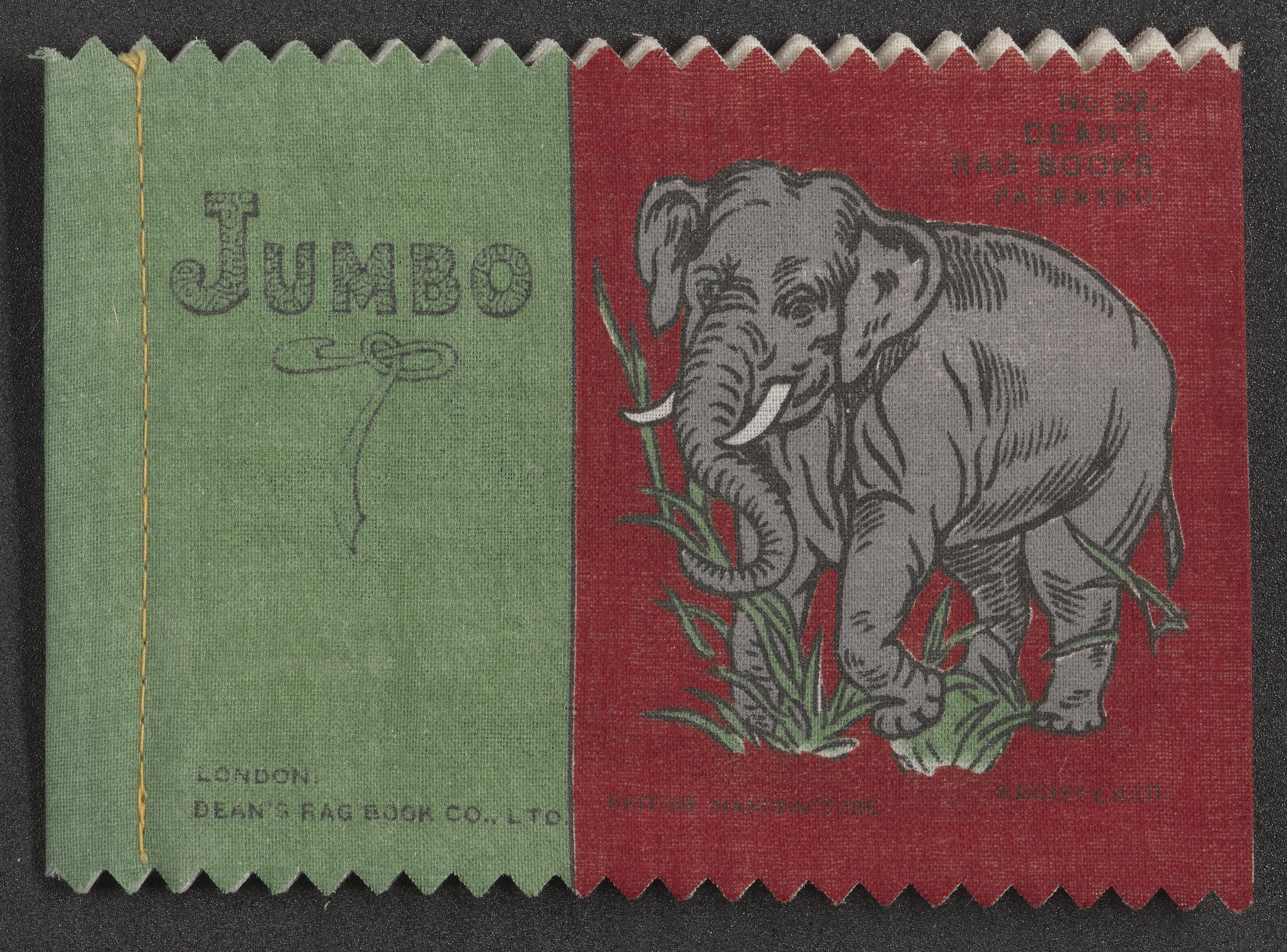The cover of a book with cloth pages, it's red and green with an image of an elephant.