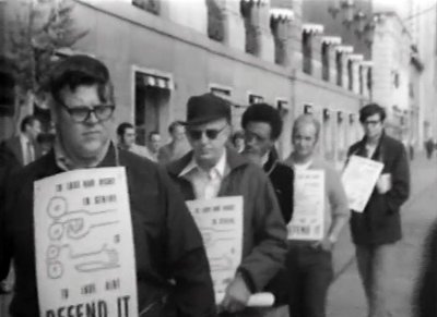 Men carrying signs