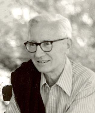 Headshot of a man wearing glasses.