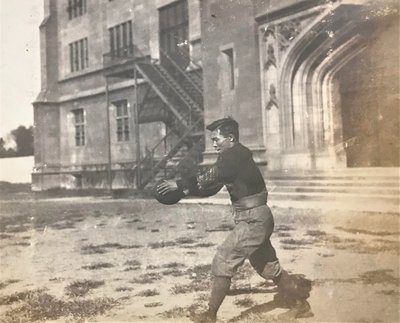 A man holds a football