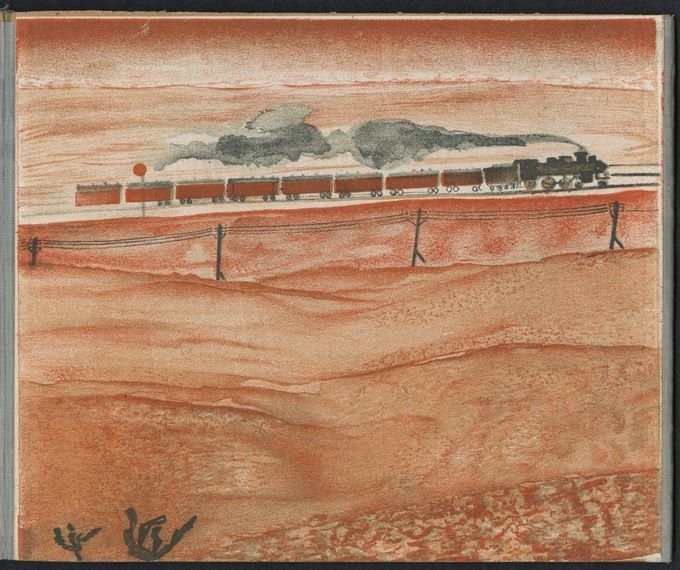A train drives through a desolate landscape.