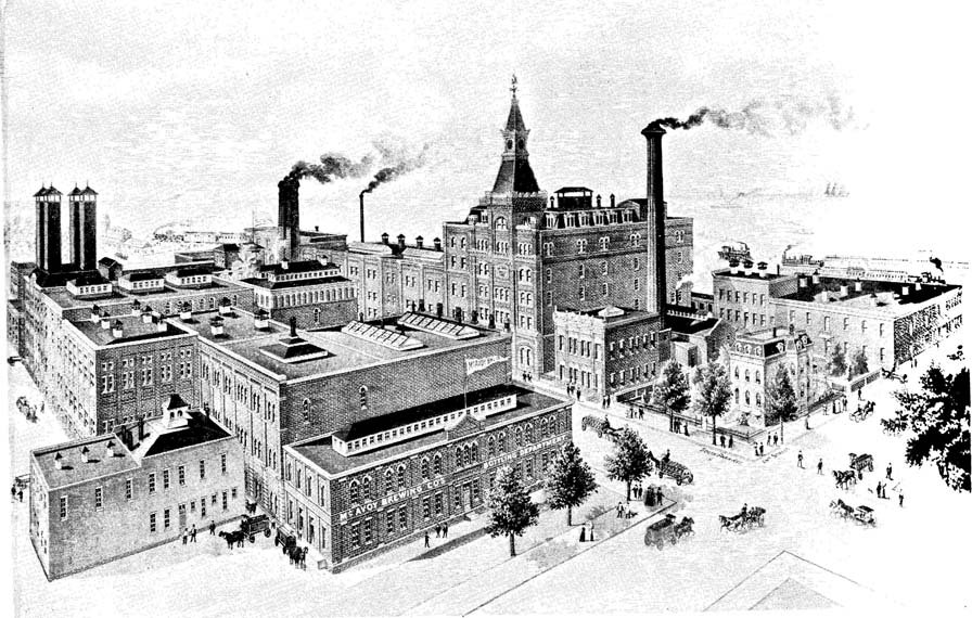 A large mill with smokestacks.