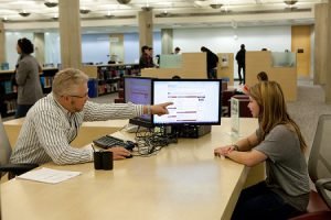 Librarian helps student