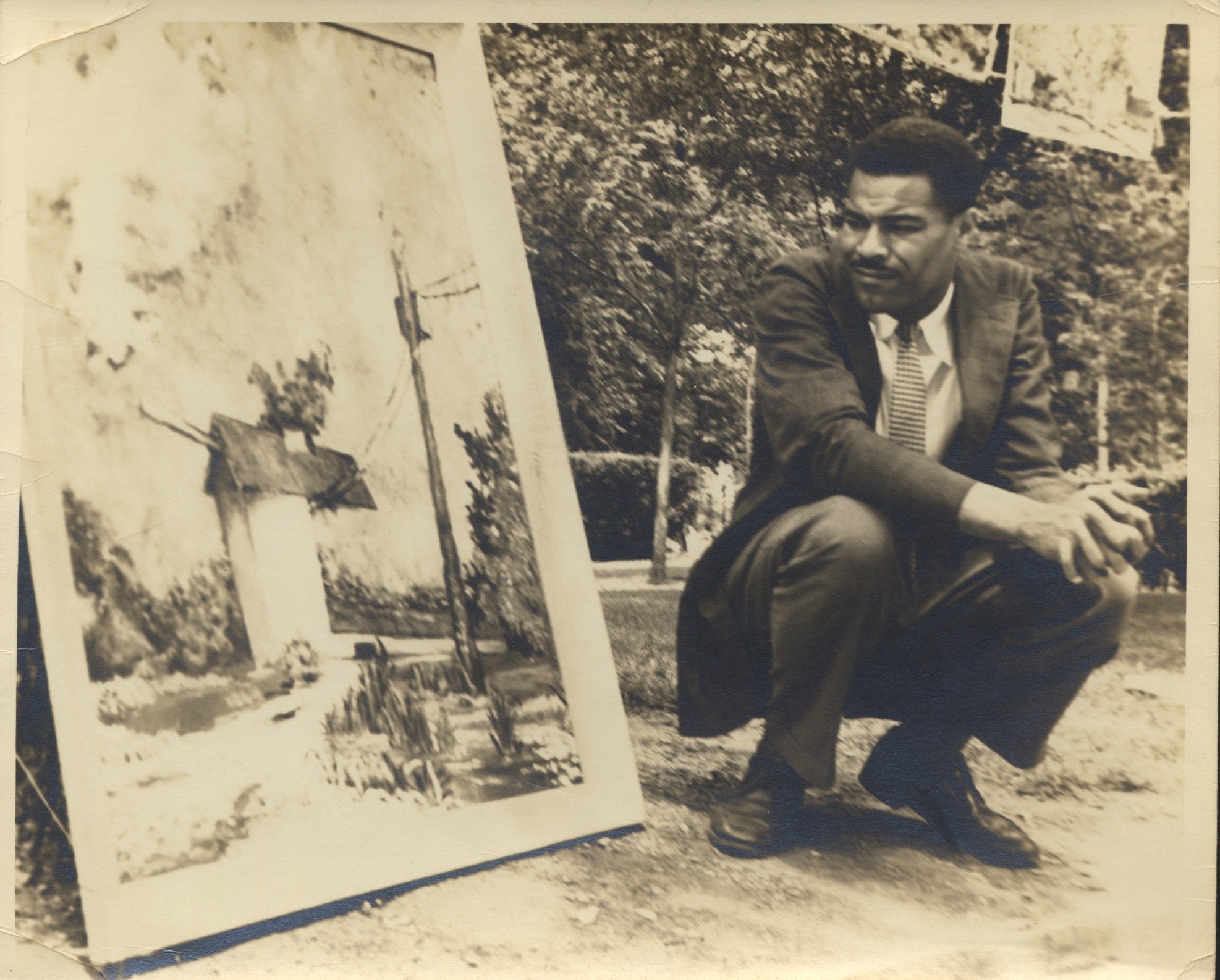 Paul Moses next to his painting "Ice House," c. 1956