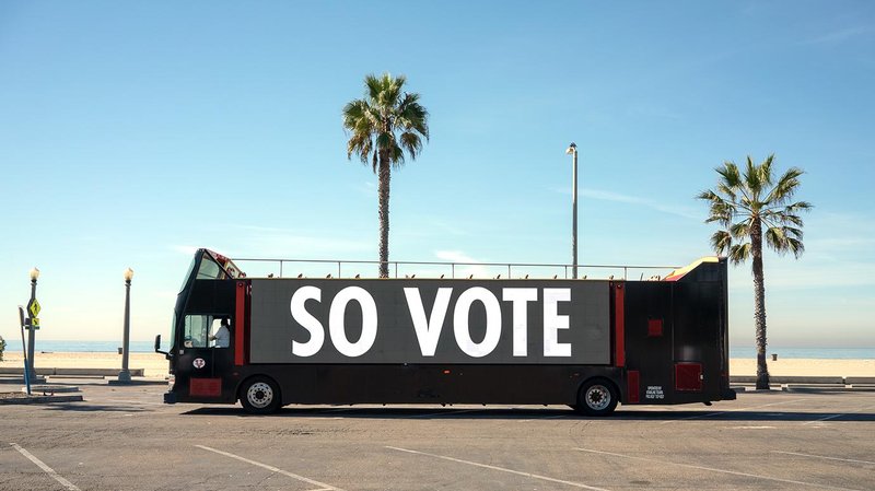 Bus with "SO VOTE" displayed on side in large letters