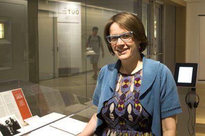 Lauren Stokes with her exhibition, 