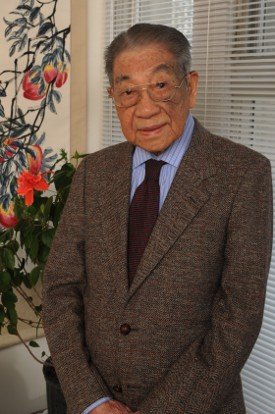 The professor T. H. Tsien, an elderly Chinese man wearing a suit and glasses.