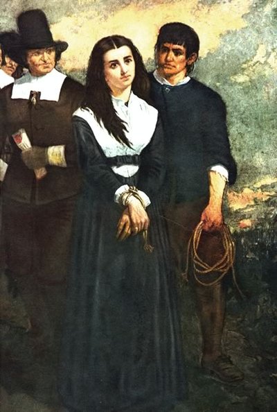 A black-haired woman stands with her hands tied in front of two Pilgrim men.