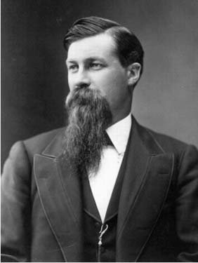 Headshot of a man with a long beard.