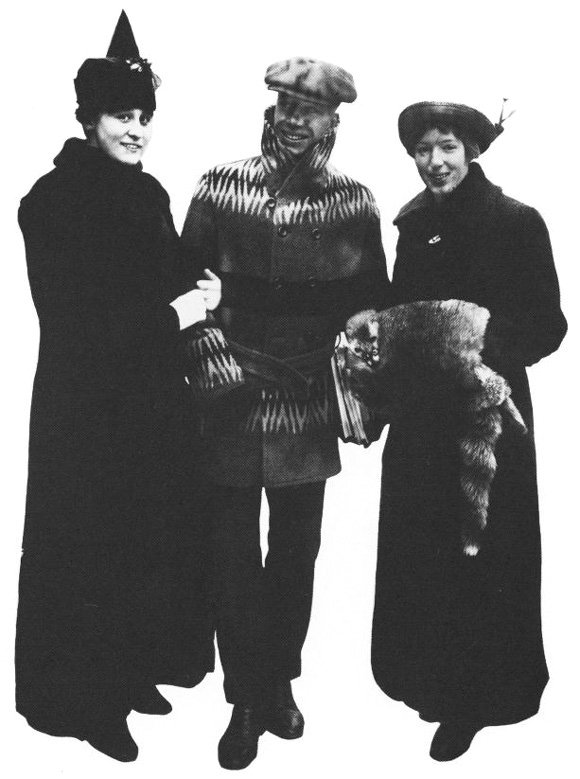 Three students attired for the winter season