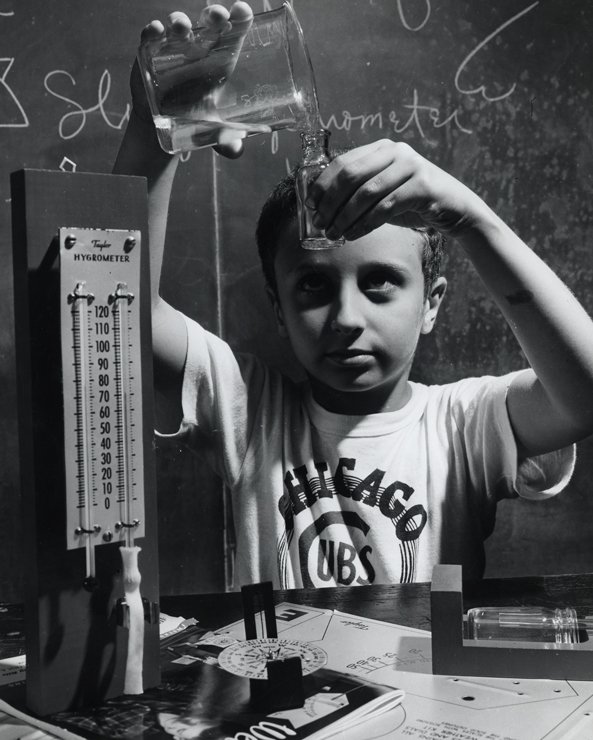 Young boy conducting a science project.