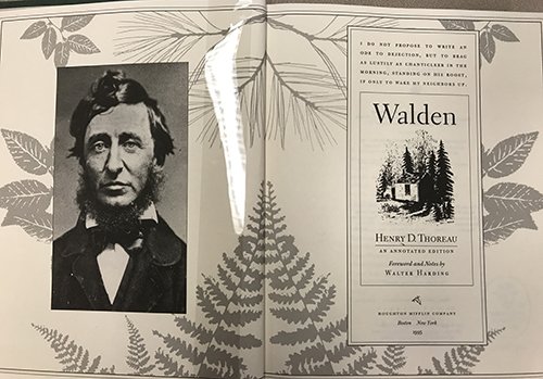 Book open, showing cover page and photo of Henry David Thoreau