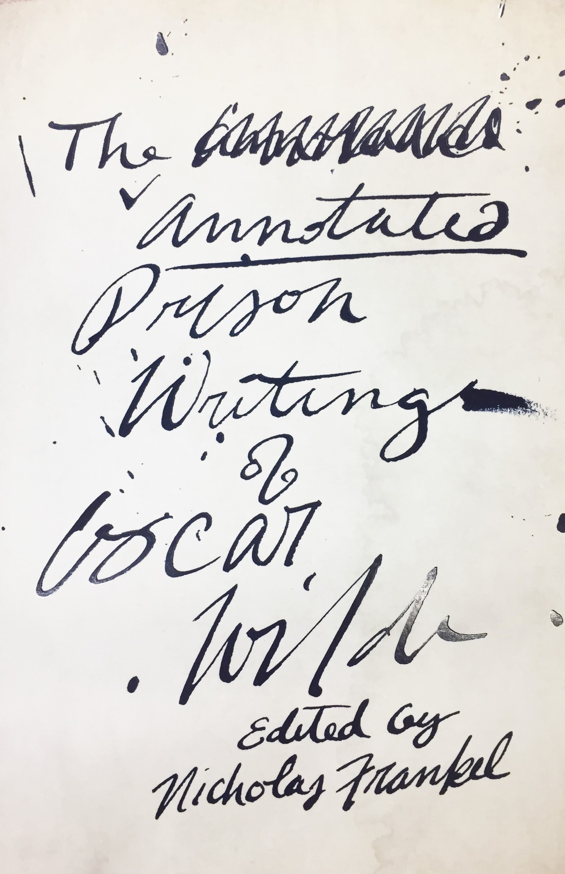 An ink-splattered page that reads in messy handwriting "The Annotated Writings of Oscar Wild, Edited by Nicholas Frankel".