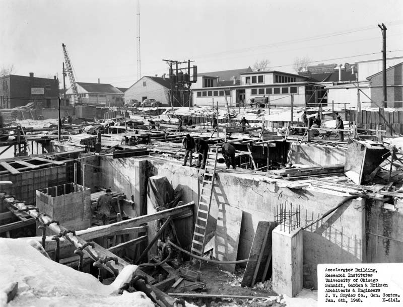 A black and white photo of a construction site, captioned, "Accelerator Building, Research Instititues, University of Chicago"