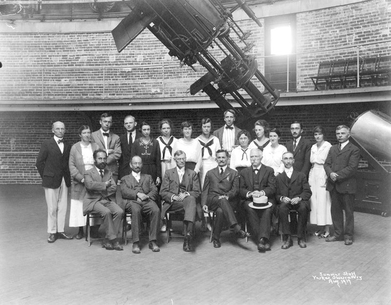 Two rows of staff members at Yerkes Observatory under telescope