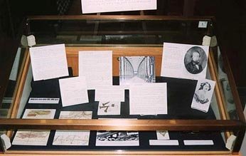 A display case holding letters and photographs.