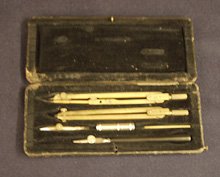 Several pencil-like instruments in a felt case.