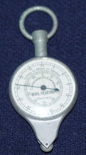 A small metal stopwatch-type instrument.