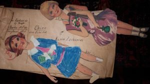 Two paper dolls and an envelope