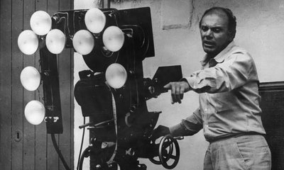 A black and white photograph of Francesco Rosi