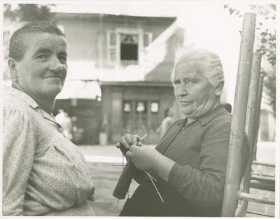 Two women, one knitting