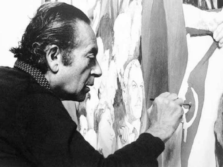 A black and white photograph of Renato Guttuso. He is in profile, and working on a painting.