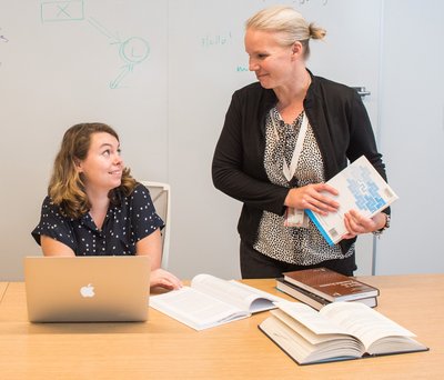 Crerar librarian helping student