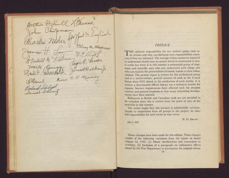 Signatures written on a blank page next to the preface of the book