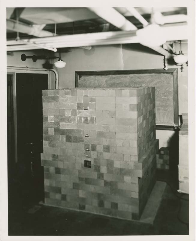 A black and white photo of the cube-shaped pile