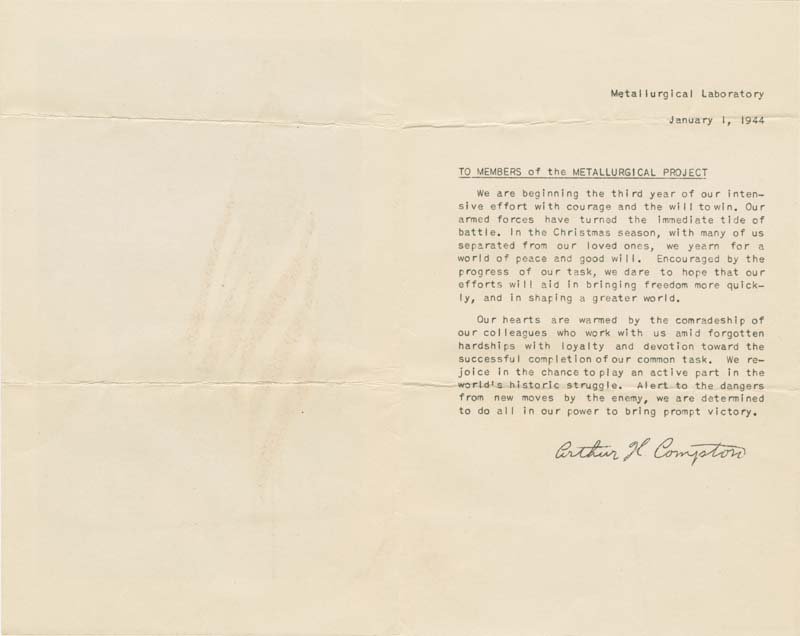 The typed message in a New Year's card from Arthur H. Compton to staff with his signature at the bottom